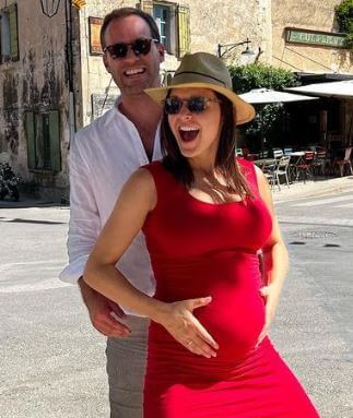 Morgan Blake with his wife Maggie Rulli flaunting the baby bump.